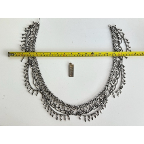 114 - Silver tone belly dancer chain and 22ct gold plated commemorative ingot