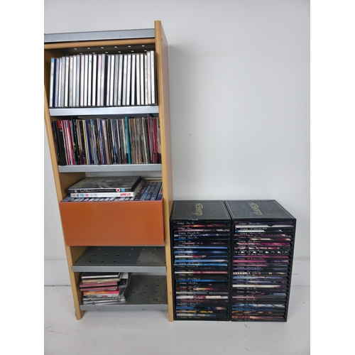 144 - Large Collection of CD's and Dvds. Together with CD Storage Rack