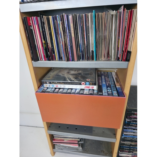 144 - Large Collection of CD's and Dvds. Together with CD Storage Rack