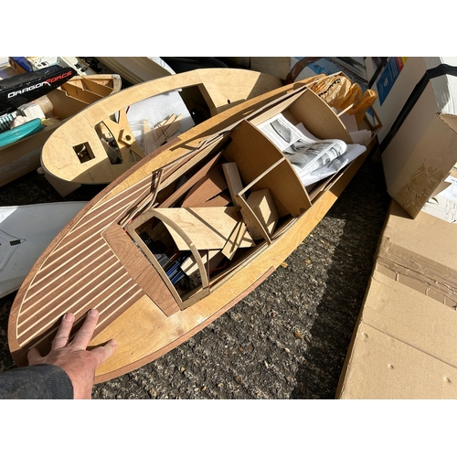 155 - Substantial quantity of remote control boats in various stages of build, wooden and plastic hulled s... 