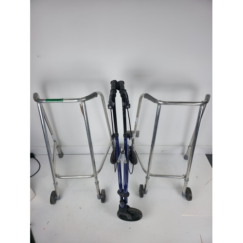 177 - Three Mobility Aids Including Two Aluminium Framed Walkers and a Folding Wheeled Walker