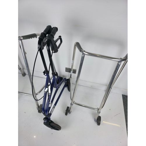 177 - Three Mobility Aids Including Two Aluminium Framed Walkers and a Folding Wheeled Walker