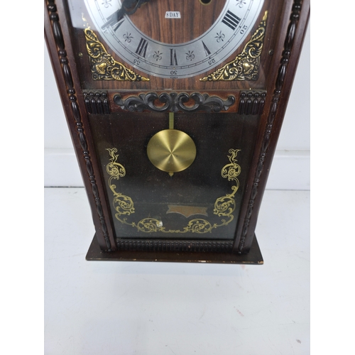 214 - Talisman 8 Day Wall Clock With Pendulum in Carved Wooden Case