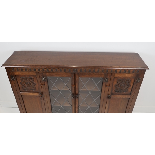 79 - A Bevan Funnell Reprodux Oak Four-Door Display Cabinet