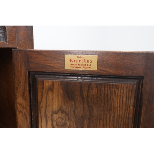 79 - A Bevan Funnell Reprodux Oak Four-Door Display Cabinet