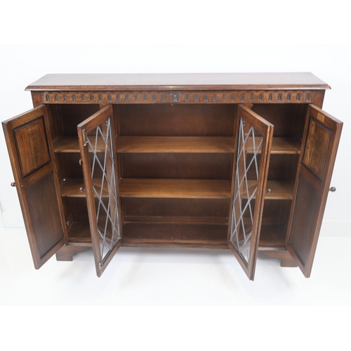 79 - A Bevan Funnell Reprodux Oak Four-Door Display Cabinet