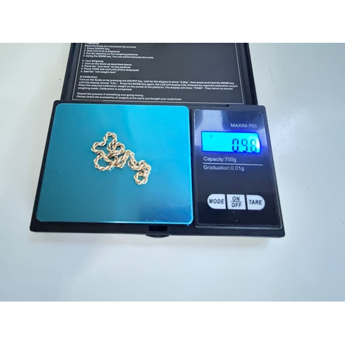 12 - Rope chain set in 9 Carat gold with full British hallmarks and gross weight of circa 1g