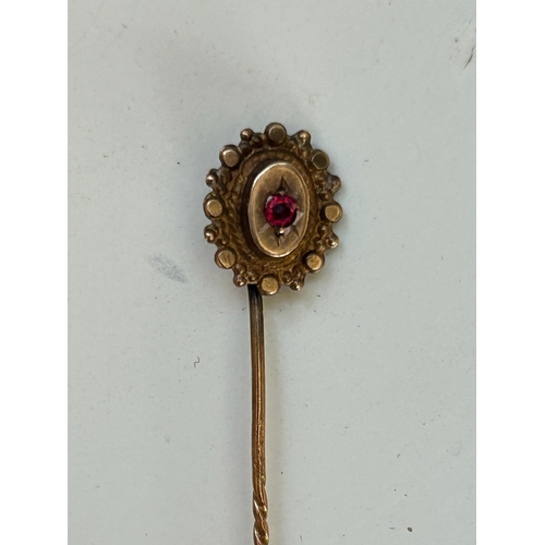 18 - Victorian stick pin, set with a Garnet.