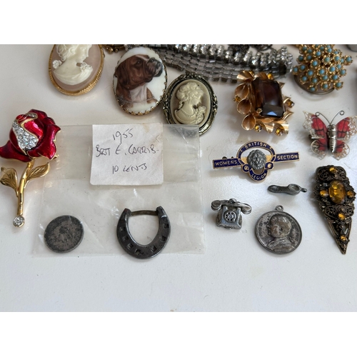 36 - An interesting lot of quality, largely costume jewellery with some silver charms that test as 925 St... 