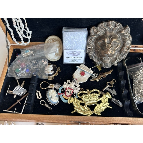 36 - An interesting lot of quality, largely costume jewellery with some silver charms that test as 925 St... 
