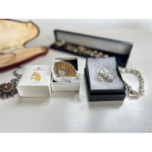 39 - Good collection of costume jewellery, including bangles, necklaces, brooch, bracelet, by Swarovski a... 
