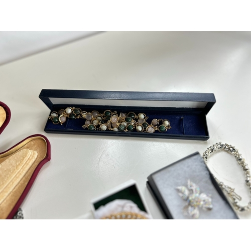 39 - Good collection of costume jewellery, including bangles, necklaces, brooch, bracelet, by Swarovski a... 