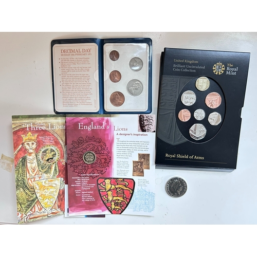 52 - A collection of uncirculated coins and one five pound coin (Â£5), including pre decimal and decimal ... 