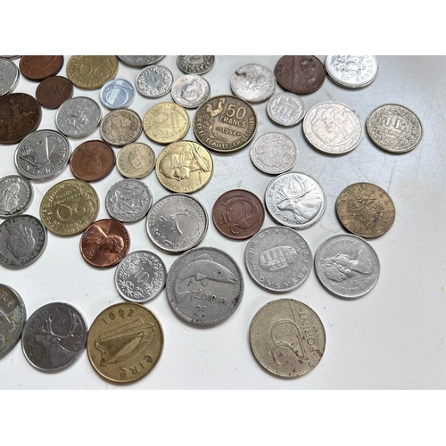 54 - Collection of mostly European coins, including Pesetas, Francs, Irish Pence, Forint etc