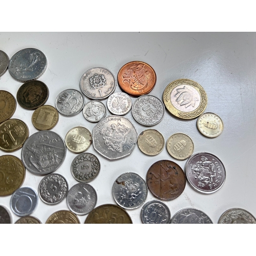 54 - Collection of mostly European coins, including Pesetas, Francs, Irish Pence, Forint etc