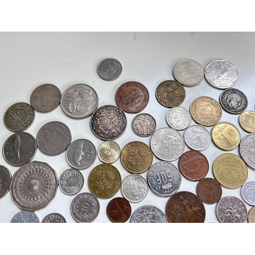 54 - Collection of mostly European coins, including Pesetas, Francs, Irish Pence, Forint etc