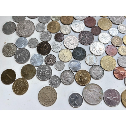 54 - Collection of mostly European coins, including Pesetas, Francs, Irish Pence, Forint etc