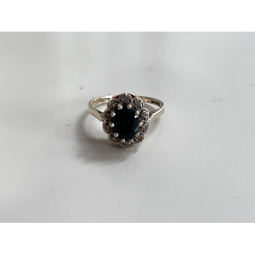 8 - Hallmarked gemstone set ring set in 9ct Gold with a gross weight of 3g