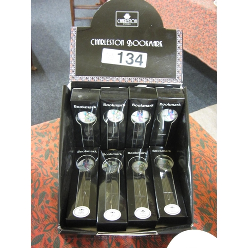 134 - Box of 8 chrome and porcelain bookmarks.