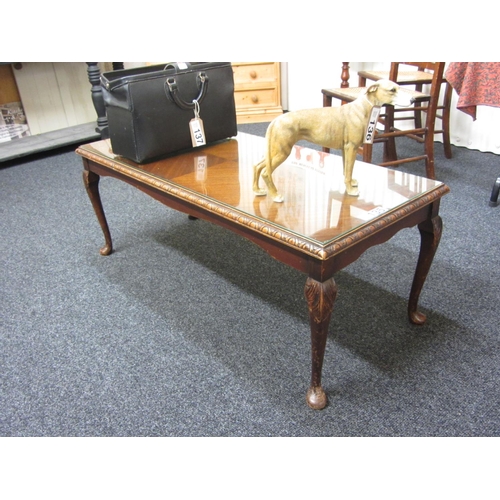 135 - Mahogany glass top coffee table.