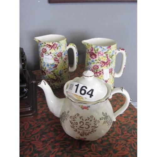 164 - Pair of Staffordshire hand painted jugs plus hand painted anniversary tea pot.