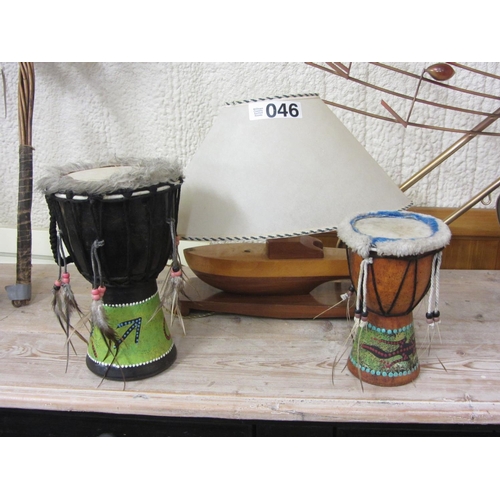 46 - Ship table lamp and 2 African drums.