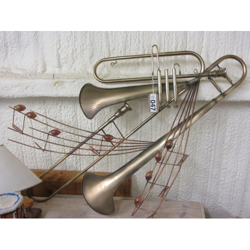 47 - Brass wall hanging instrument.