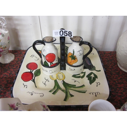 58 - Large hand painted platter plus vinaigrette jugs on stand.