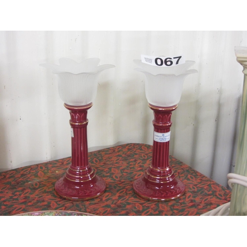 67 - Pair of ornate candle holders.