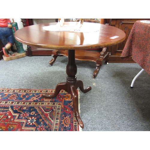 700 - Georgian mahogany tip up table on pod. Top:76cm