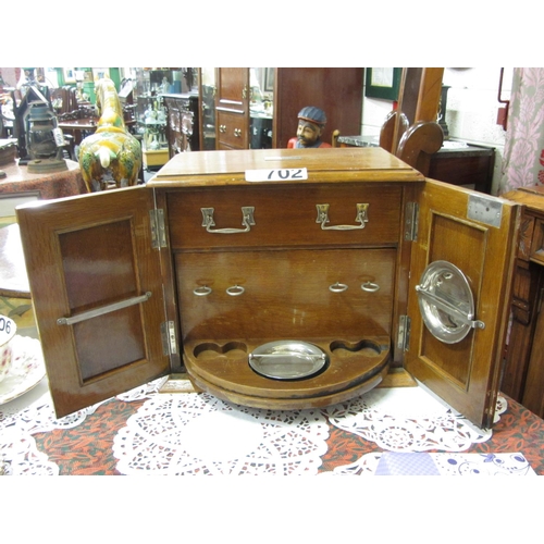 702 - Oak smokers cabinet with fitted interior.