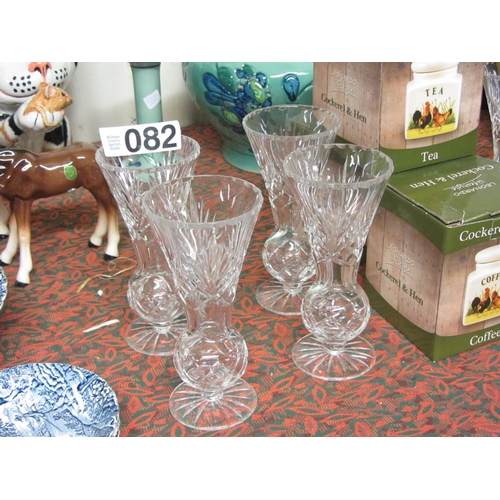 82 - Set of 4 cut glass vases.