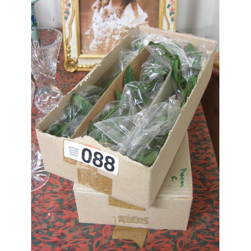 88 - 2 boxes of porcelain roses.