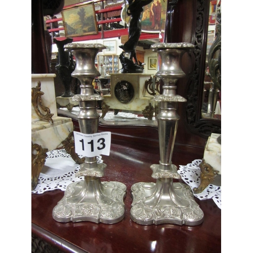 113 - Pair of silver plated candle sticks.