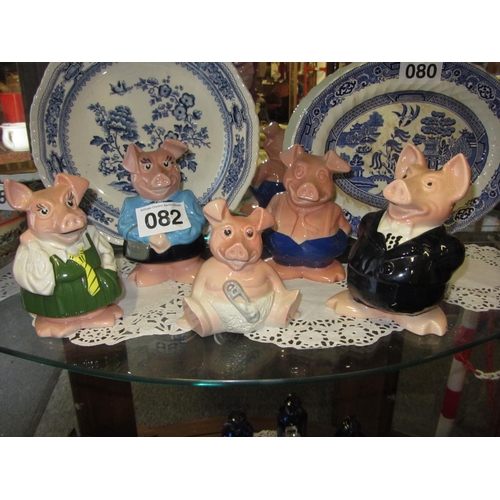 82 - Family of hand painted porcelain Pigs.