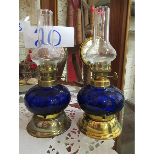 20 - Pair of colored bowl oil lamps with mirror back. H:17cm