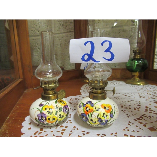 23 - Pair of miniature hand painted oil lamps.  H:15cm