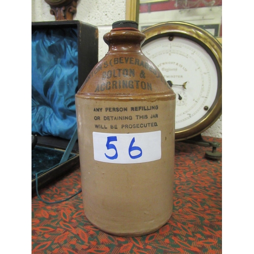 56 - Antique Earthenware whiskey jar with handle and stopper. Stantons, Beverabes Ltd Bolton.