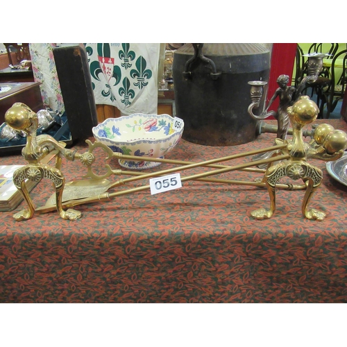 55 - Good heavy set of brass fire dogs plus fire irons.