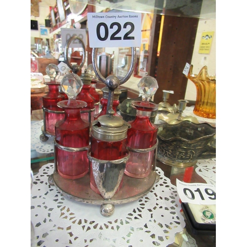 22 - Coloured glass condiment set.