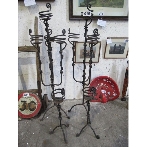 10 - Set of 4 wrought iron candelabra H:110cm.