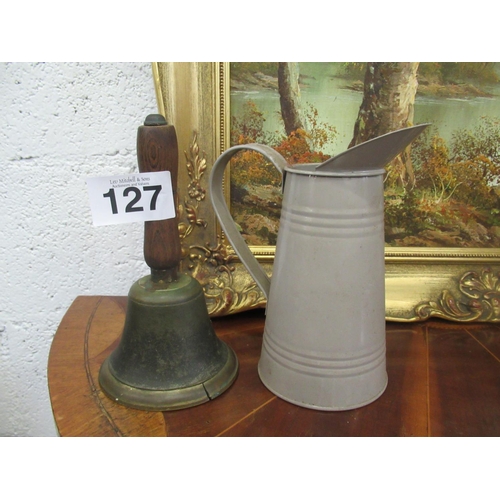 127 - Antique farm bell and farm jug.