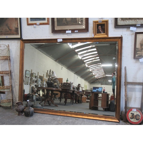 21 - Large beveled over mantle mirror in gilt frame.  210cm x 150.