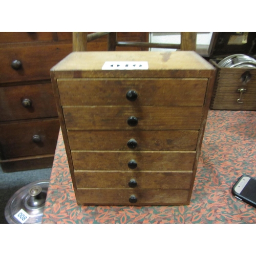 10 - Antique pine miniature 6 drawer collectors chest. H:28cm, W:23cm, D:30cm.