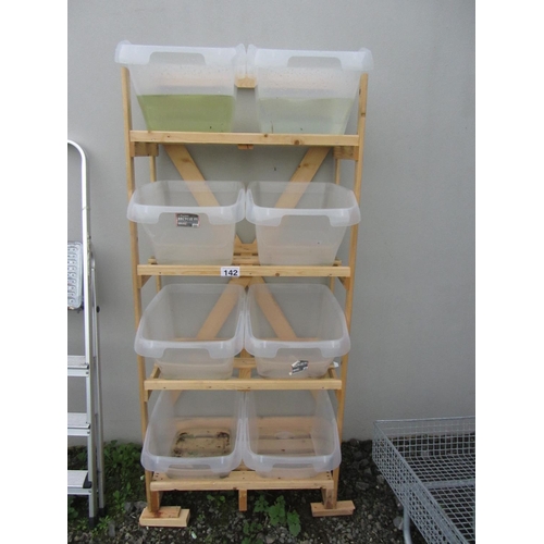 142 - Pine garage unit with 8 plastic containers.  H:170cm, W:76cm, D:40cm.