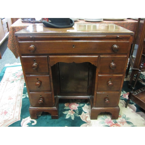 215 - Neat size georgian mahogany desk with enclosed cupboard 8 drawers plus pull out writing slide.  H:76... 