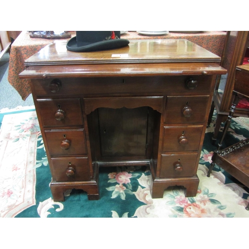 215 - Neat size georgian mahogany desk with enclosed cupboard 8 drawers plus pull out writing slide.  H:76... 