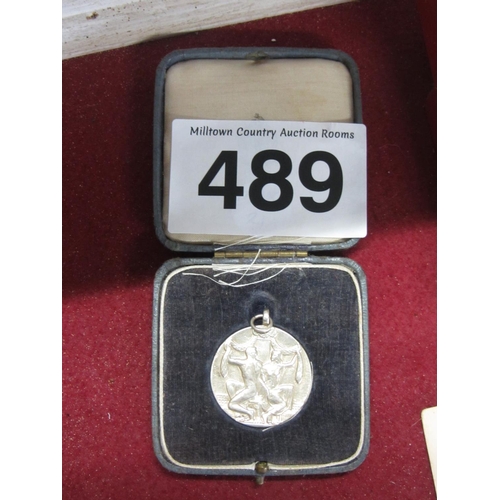 489 - Solid silver optician medal.