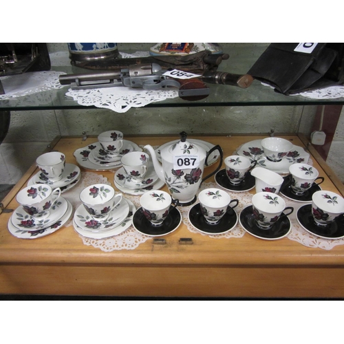 87 - Royal Albert Black Rose 35 piece tea and coffee set.