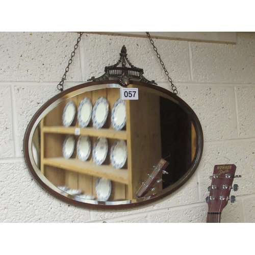 57 - Antique oval copper beveled wall mirror.  66cm x 54cm.